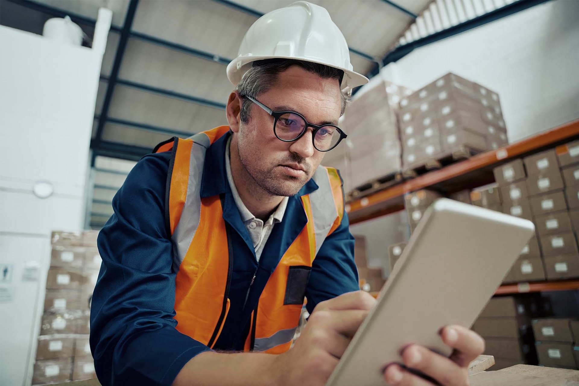 A manufacturing worker using an app for Ecommerce inventory. 