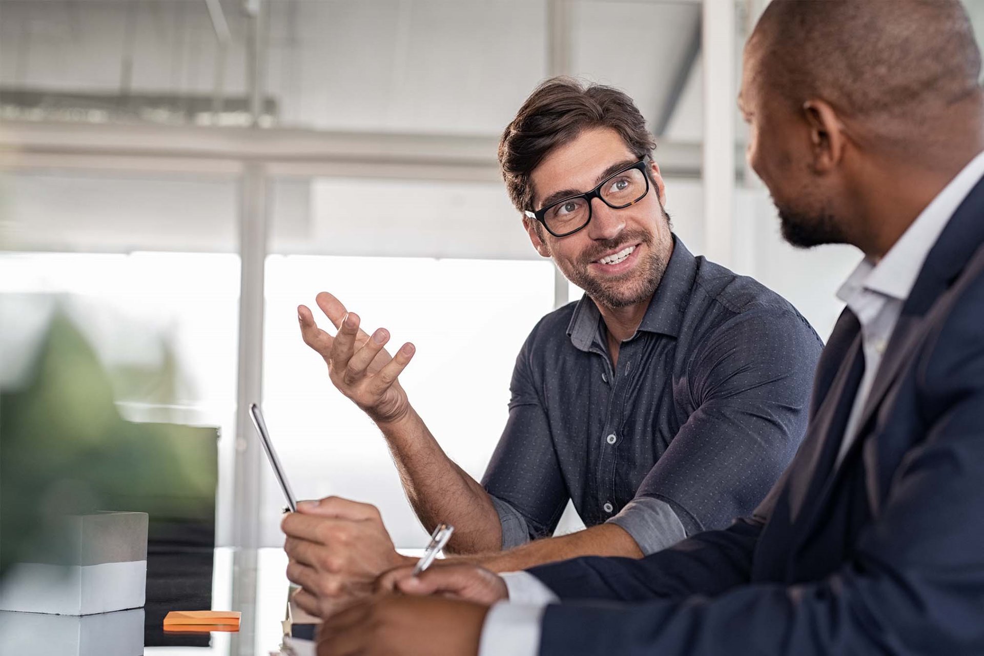 Two team members engaged in conversation. 