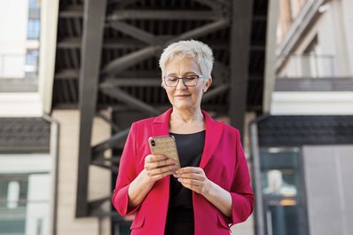 A business professional using a smartphone to get the job done. 